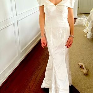 Off the shoulder white satin gown. Simply elegant.